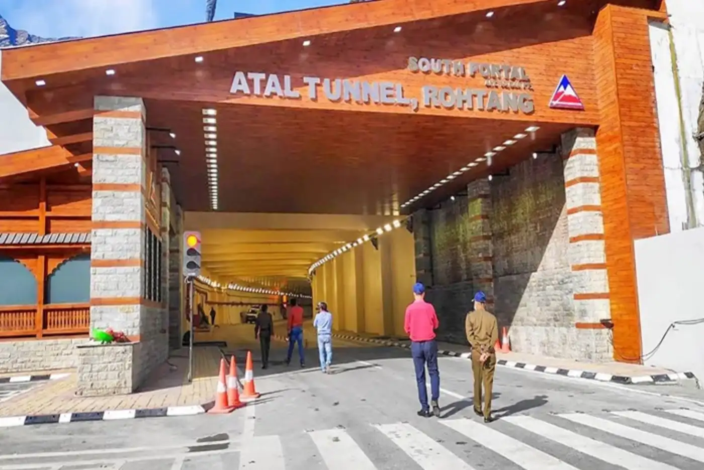 Atal Tunnel, Rohtang South Portal entrance. People walking toward the tunnel.